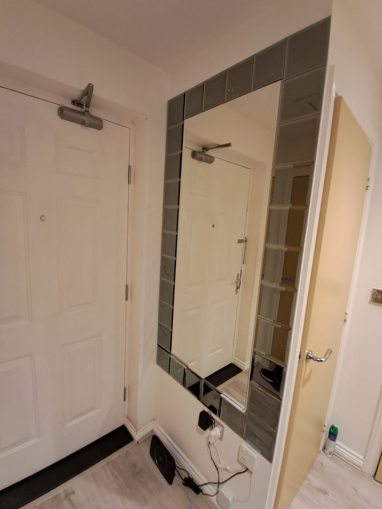 Custom mirror wall feature in a London apartment