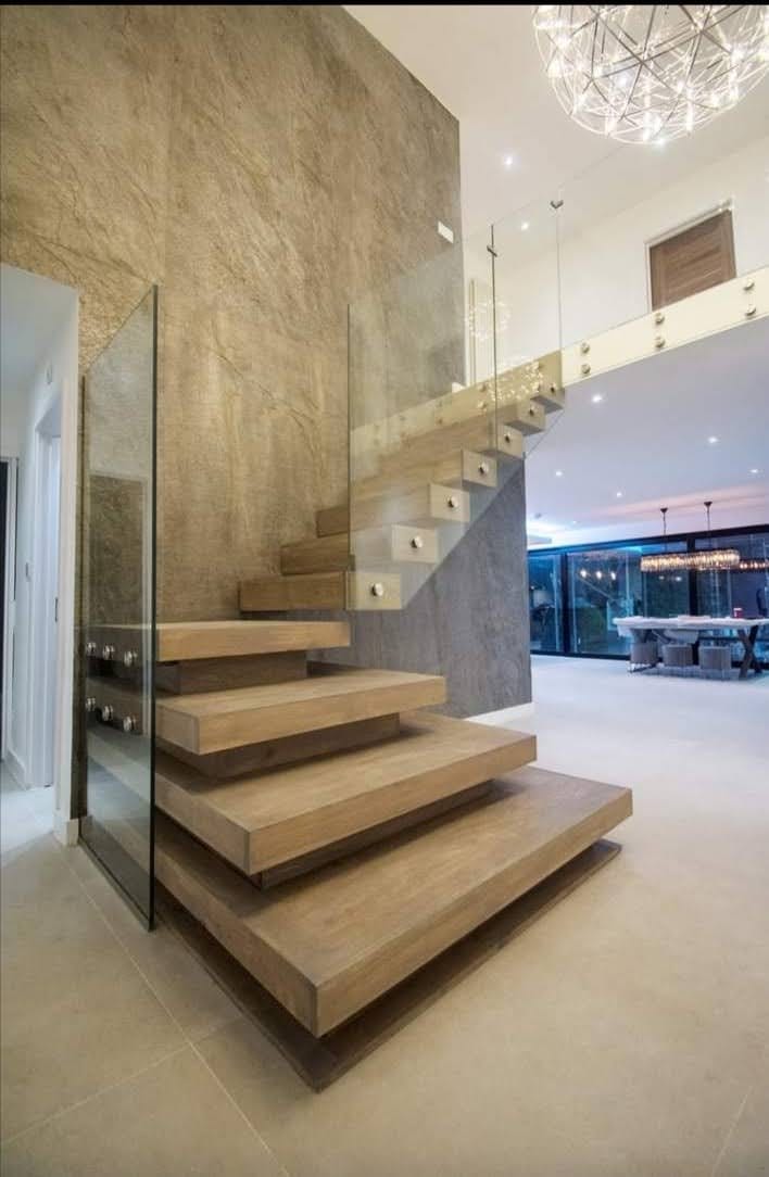 Frameless glass balustrade installation on stairs in London home